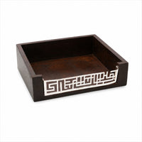 Enigma Memopad is a silver notepad holder with a geometric maze fretwork lip across the front of an open dark wood tray. - white background