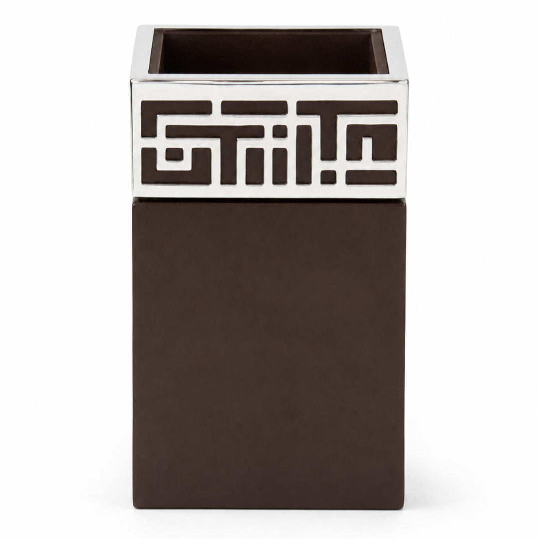 Enigma Penstand is a silver pen stand with a geometric maze fretwork collar around the rim of a square dark wood cup. - white background