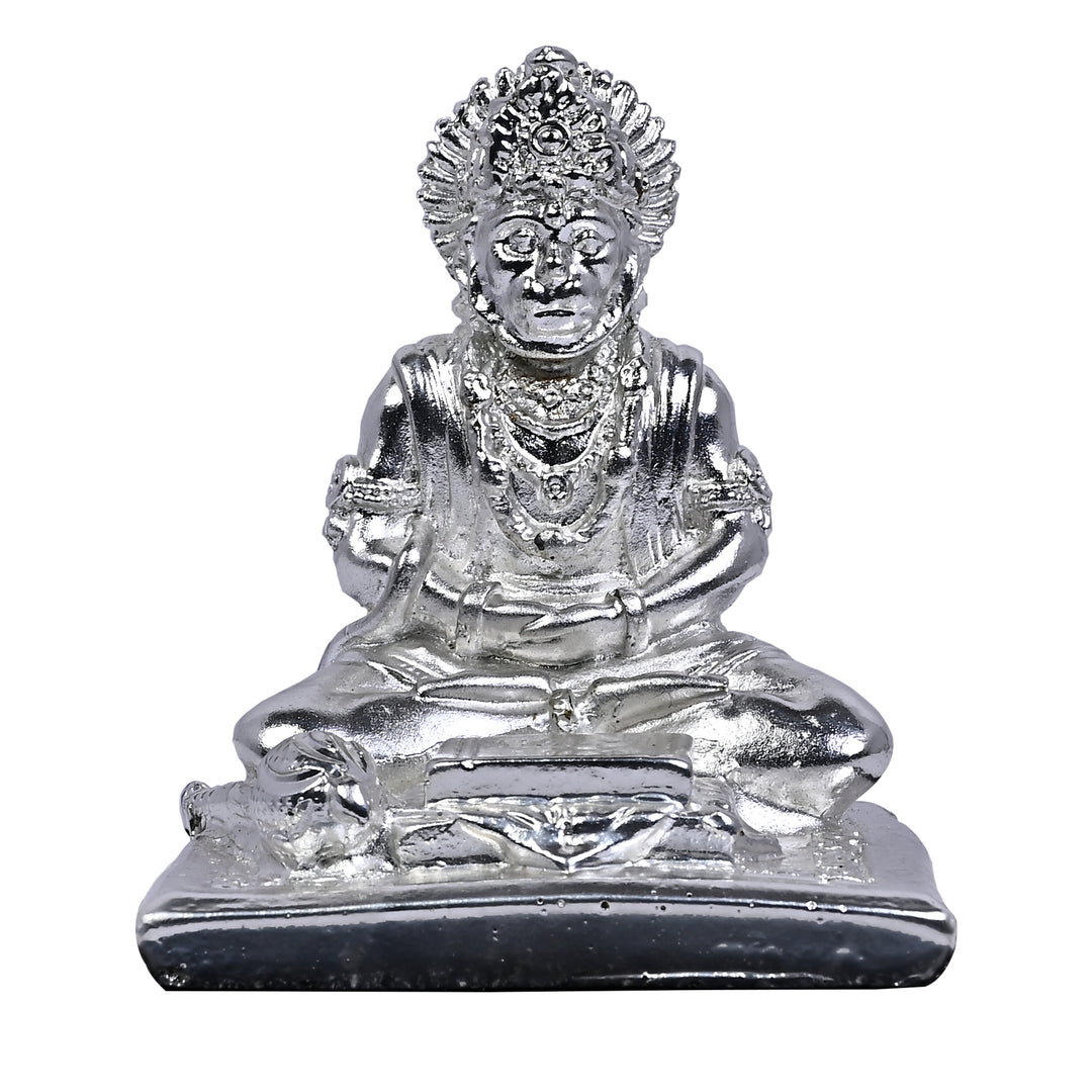 Hanuman Anjani Putra sits a silver Hanuman idol in a meditative pose - white background