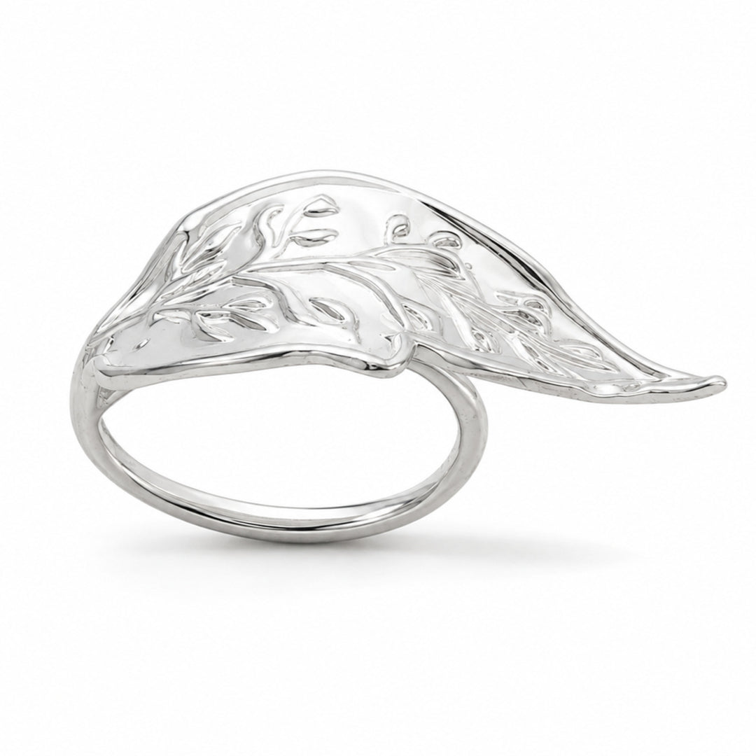 Leaf Napkin Ring is a silver napkin ring, a plain polished band carrying a cast leaf spray with veined, budded leaflets across its top - white background