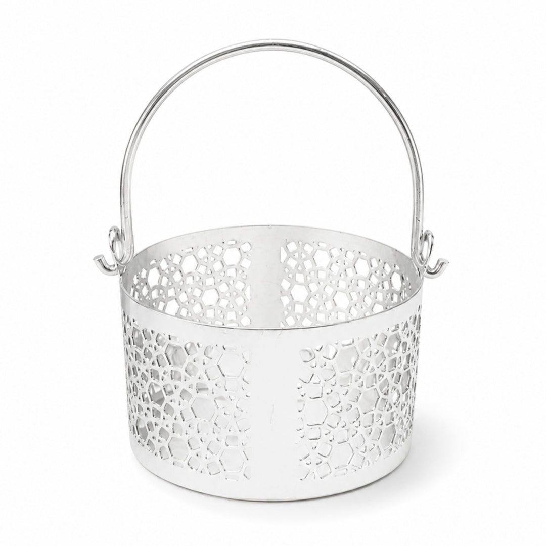 Mosaic Lantern is a silver lantern with a short pierced drum and a tall arched swing handle, its wall alternating mosaic cutwork with plain panels - white background