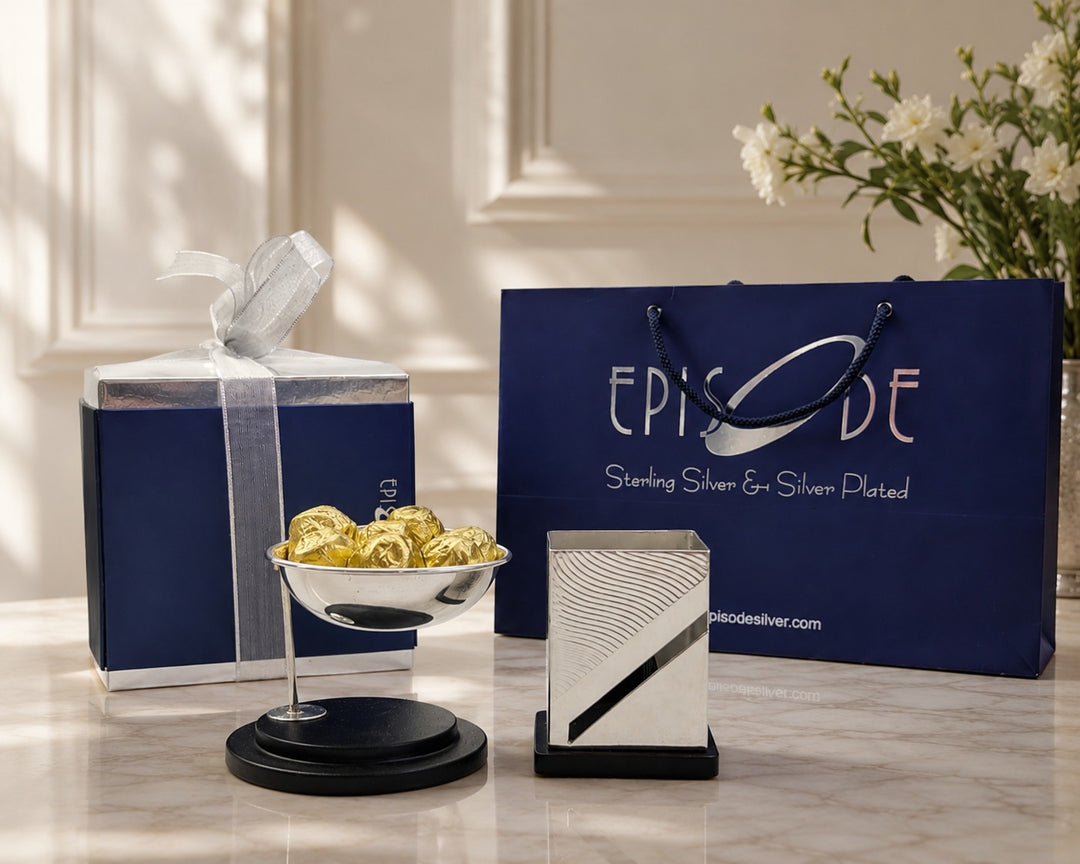 Rakhi Gift Set 8 - Swinging Nut Bowl and Fluid Pen Stand with chocolates in an Episode gift box