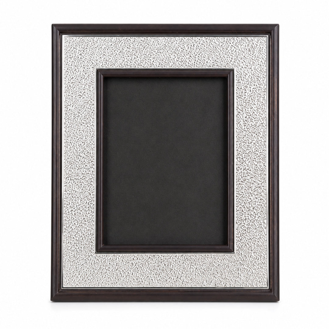 Terra Photo Frame Small is a silver photo frame setting a wide textured silver mat between a dark brown wood outer moulding and an inner wood lip - white background