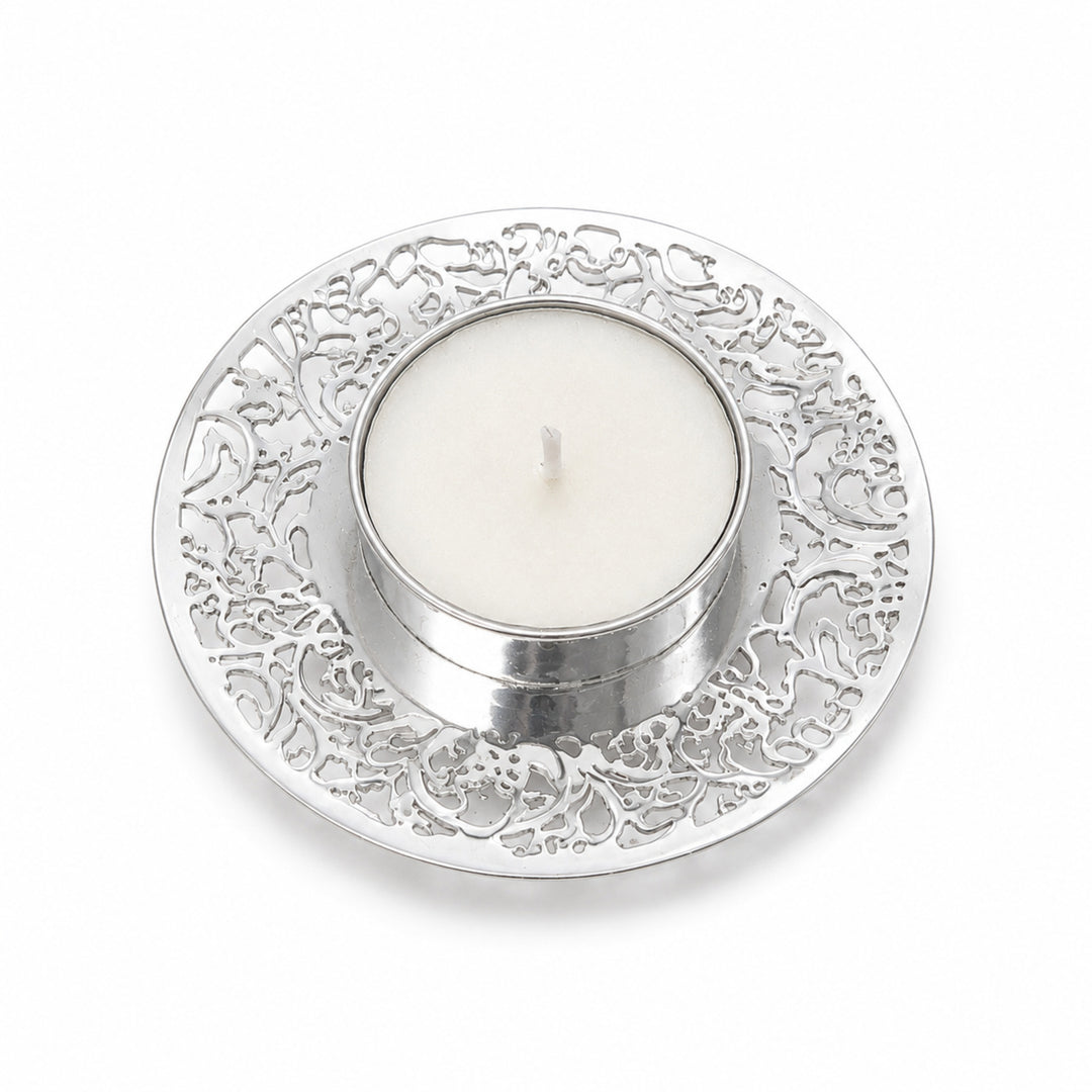 Tree Of Life Round Tealight Small is a silver tealight holder shaped as a small saucer, its rim pierced with a fine scrolling tree pattern around a flat central seat - white background