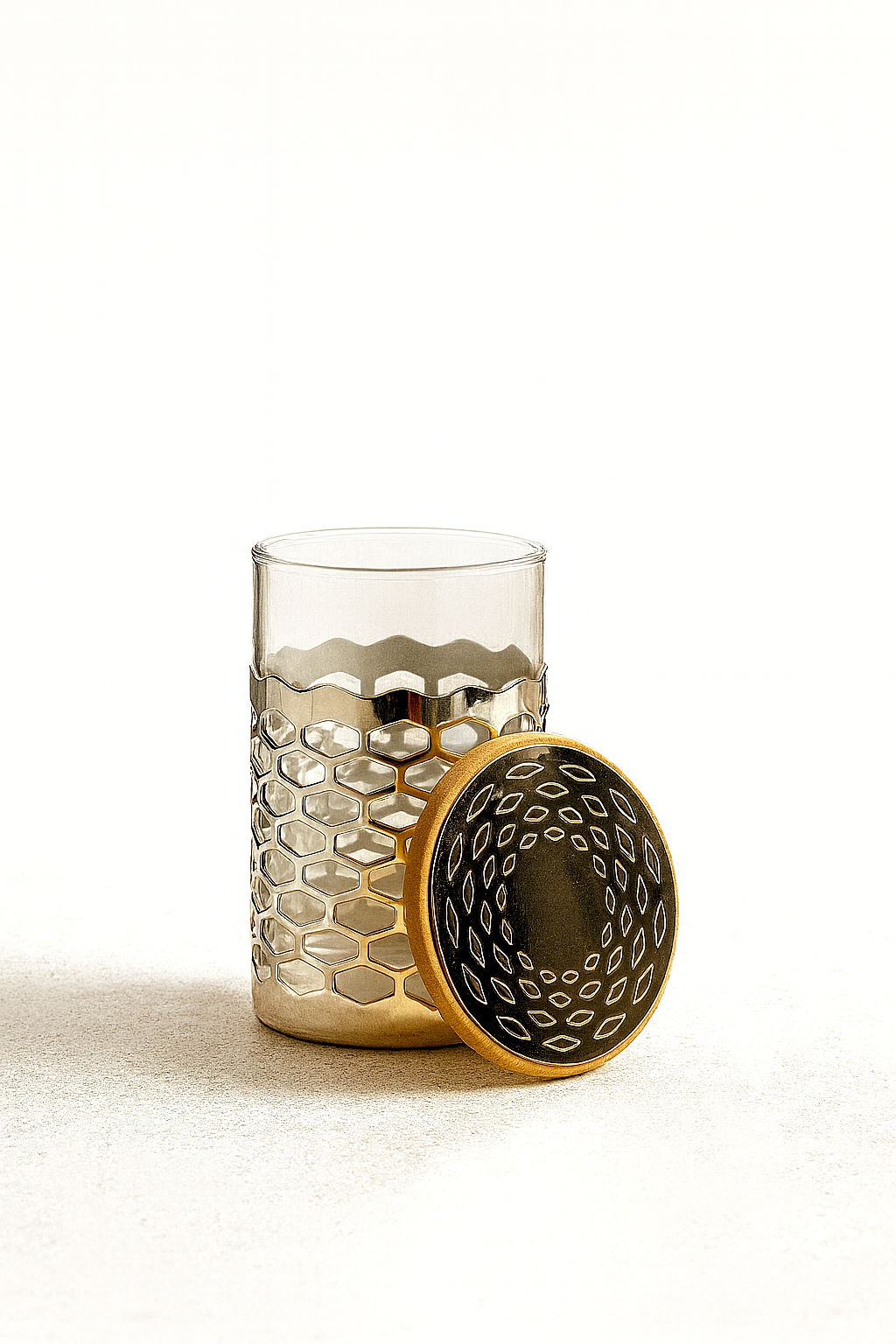 Chakra Jar is a silver jar with a glass liner wrapped in a honeycomb cutwork band - white background