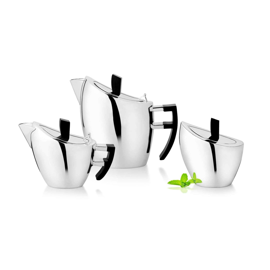 Tea Set Iris centres on a silver teapot paired with a matching creamer and sugar bowl - white background