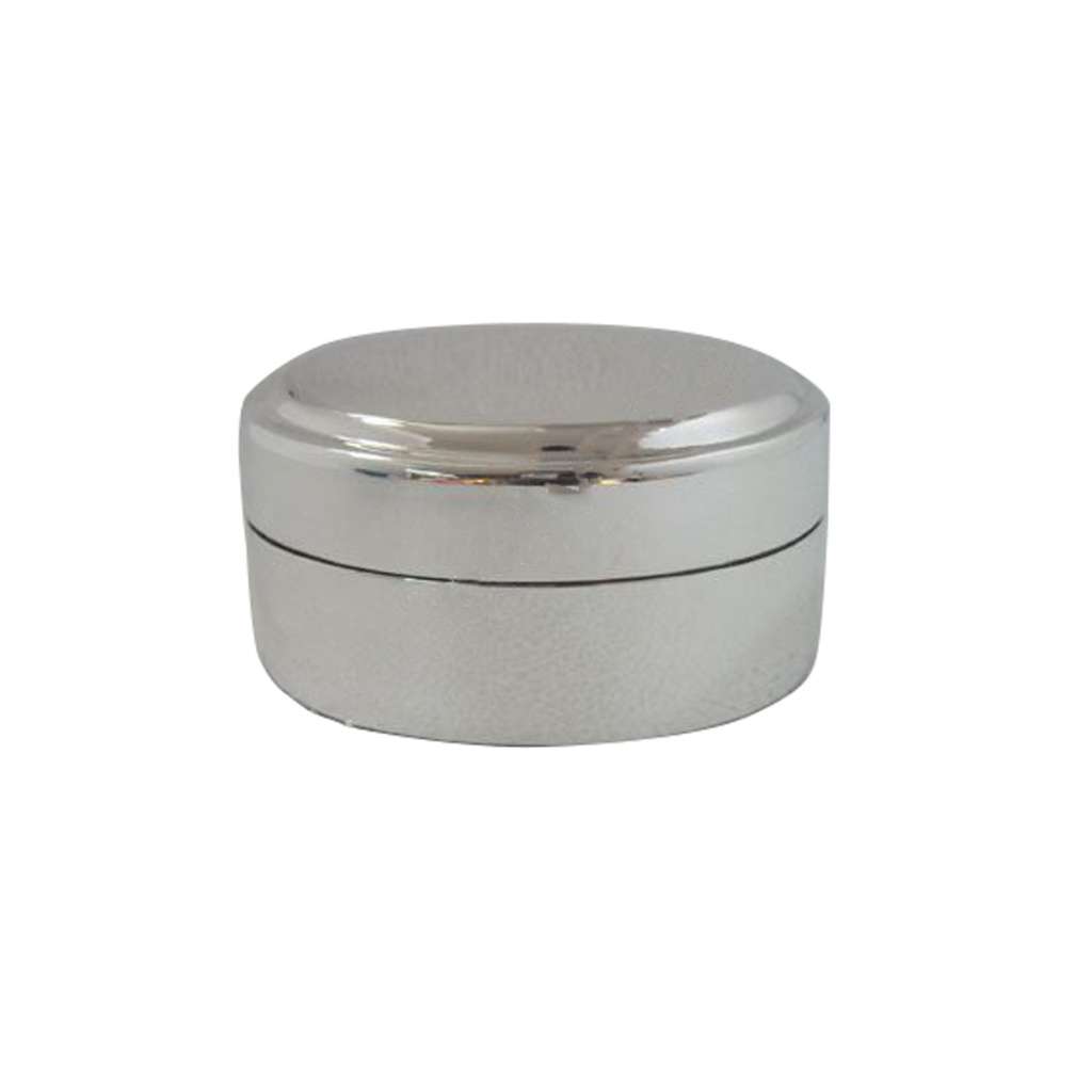 Powder Box Round is a silver box taking the shape of a low, round drum, its gently domed lid lifting away in one smooth piece - white background