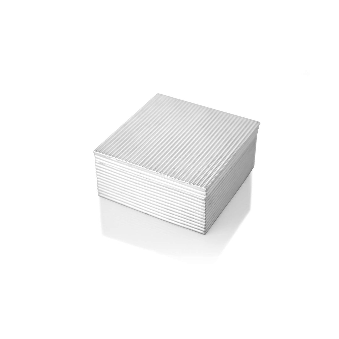 Box Ribbed is a silver box with a fine, linear ribbed texture wrapping its flat lid and sides - white background