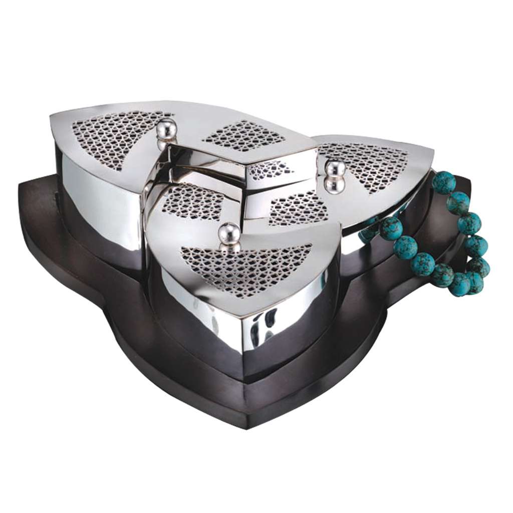 Box Trilogy is a silver box made of three petal-shaped compartments meeting at a central hinge to form a single trefoil silhouette - white background