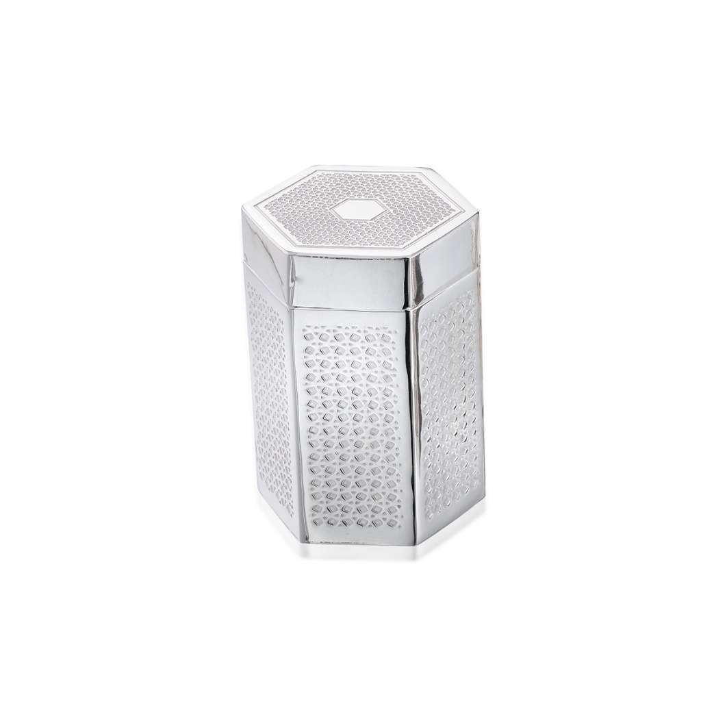 Box Hexa rises as a tall, hexagonal silver box - white background