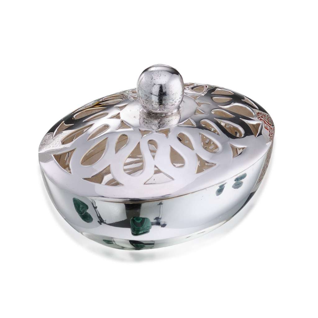 Box Omega is a silver box with a compact oval shape and dressing-table charm - white background