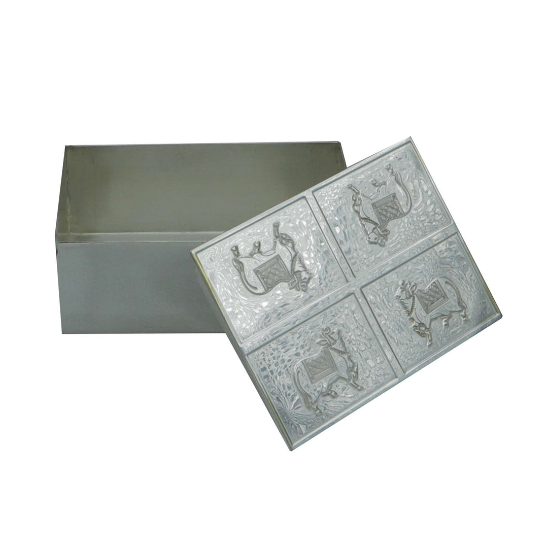 Box Kamadhenu is a silver box with the kamadhenu, the wish-fulfilling cow of Hindu mythology - white background