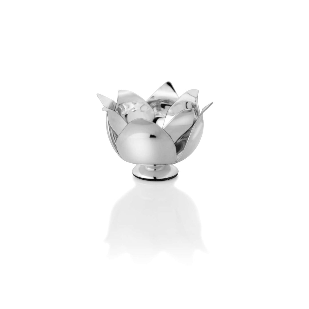 Diya Lotus is a silver diya raised on a small pedestal to catch light from every side, opening into a lotus bloom shape - white background