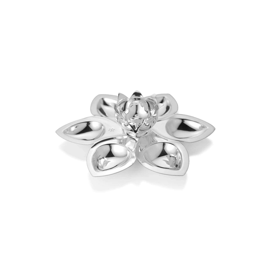 Pooja Thali Lotus Set opens a silver tray into six petals forming small wells around a central flower that doubles as a diya holder - white background