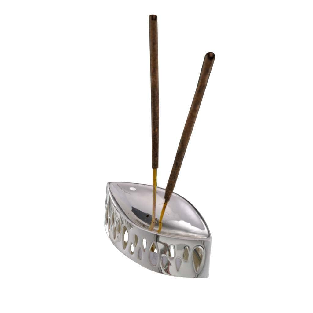 Incense Holder Divine traces teardrop cutouts along the curved sides of this boat-shaped silver holder - white background