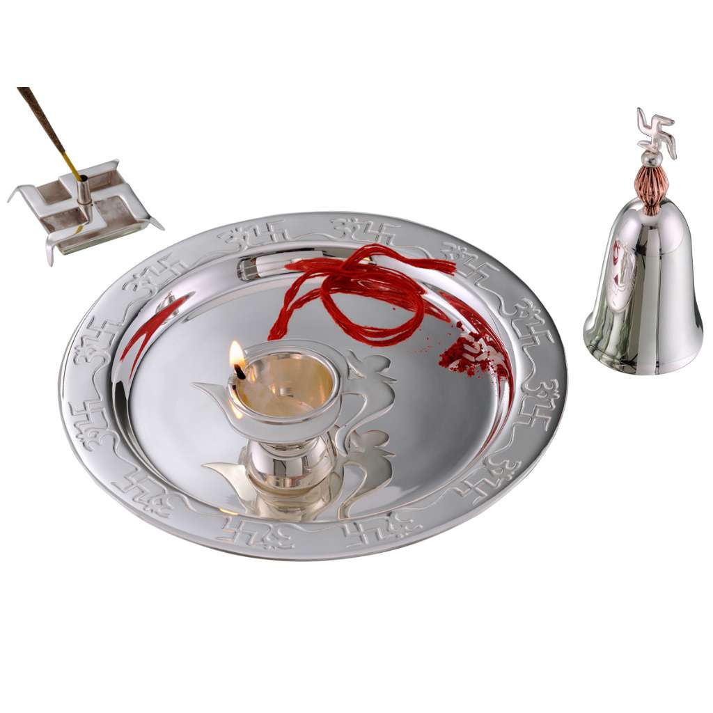 Pooja Thali Shagun Set wraps a fine engraved border around a silver tray, paired with a bell topped by a small coral-toned bead finial - white background