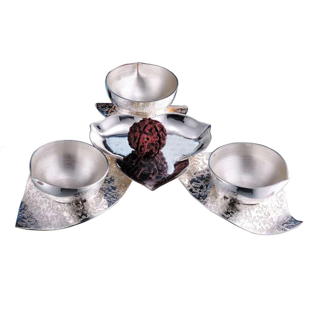 Diya Anjali is a silver diya that fans three or five brushed wick cups out like petals around a natural rudraksh bead – 3 Lite
