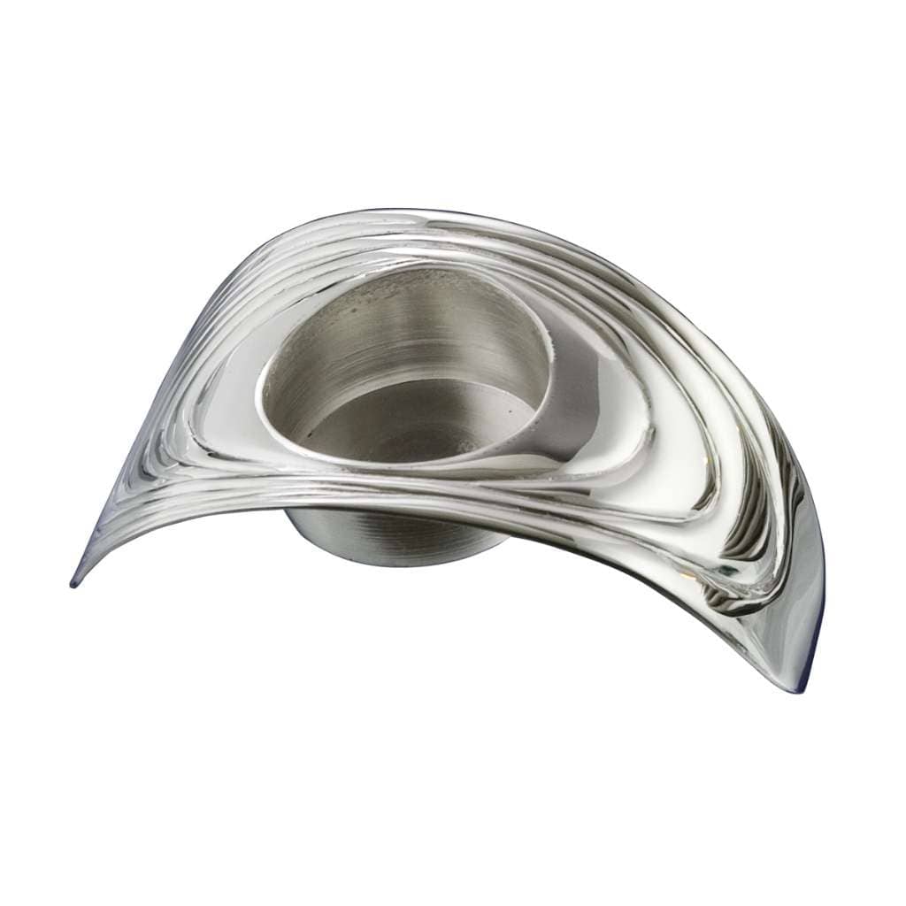 Candle Stand Drapes is a silver candle stand that flows across the table in a low, ribbon-like form – Unilite