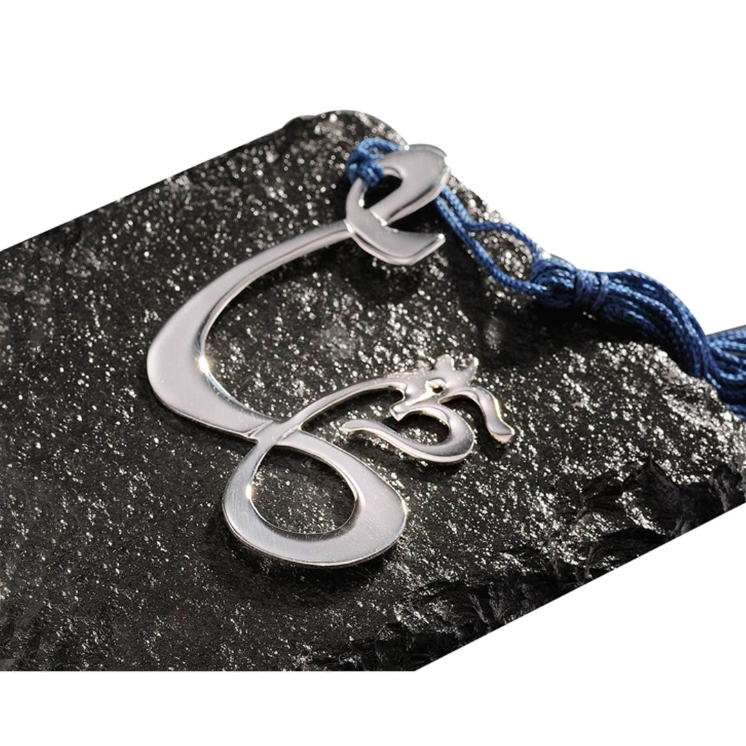 Bookmark Omshree cuts the Om symbol clean and bright across this silver bookmark, finished with a deep blue tasselled cord - white background