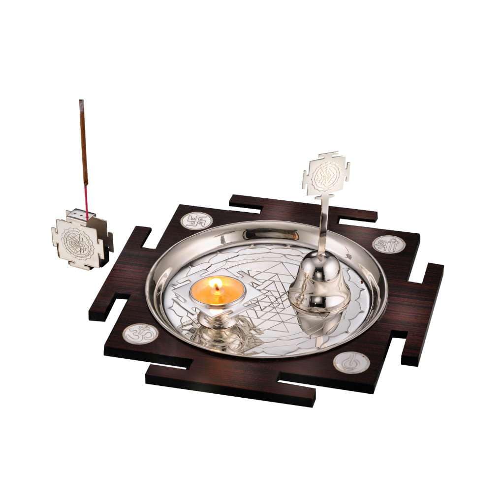 Pooja Thali Shree Yantra sets a round engraved silver tray on a Shree Yantra-shaped wooden base - white background
