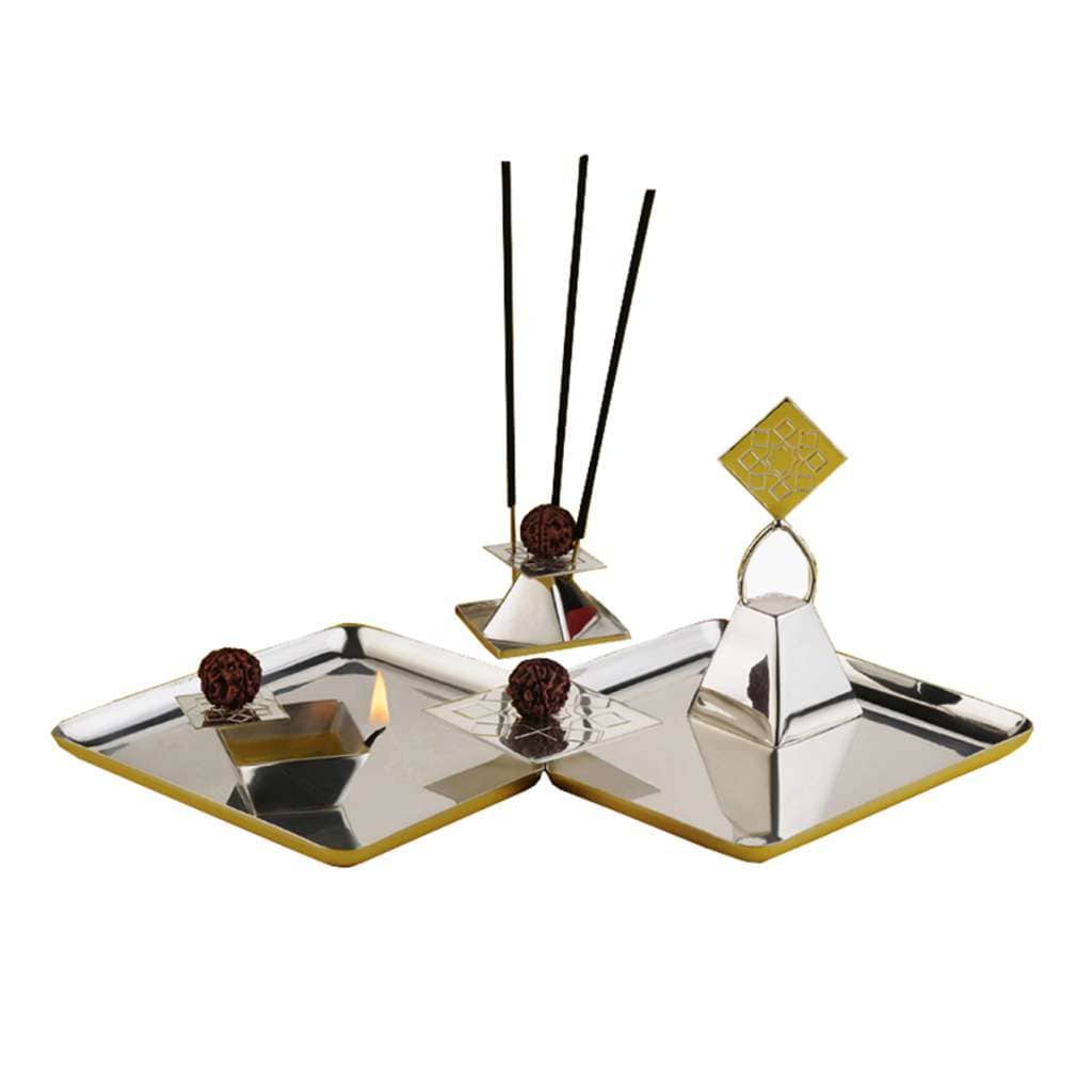 Pooja Thali Mandala reimagines the mandala as an angular rather than circular form, built on two interlocking square silver trays - white background