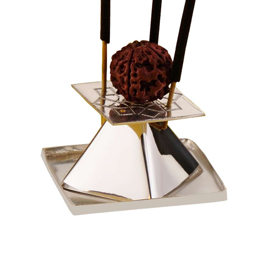 Incense Holder Mandala is a silver incense holder that etches a mandala pattern across a square plate - white background