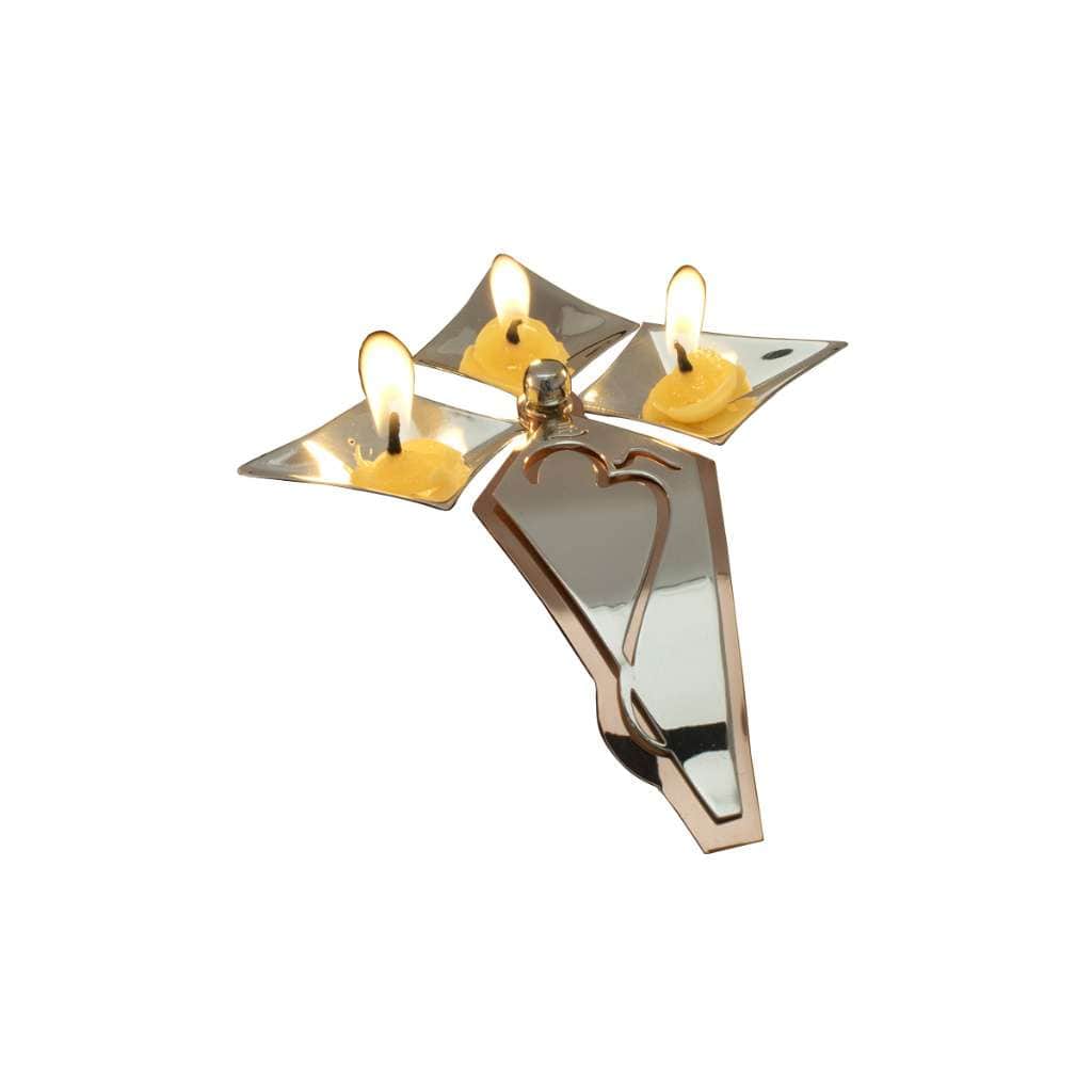 Trinity Om Diya is a silver diya that brings together three diamond-shaped wick cups arranged like a trefoil around a central pivot - white background