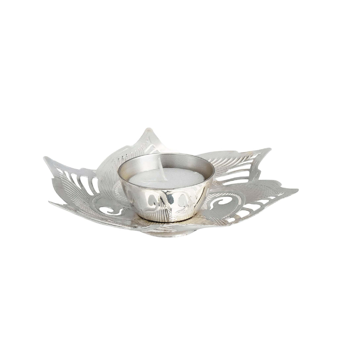 Tealite Holder Mayur is a silver tea light holder shaped like a fanned peacock feather - white background