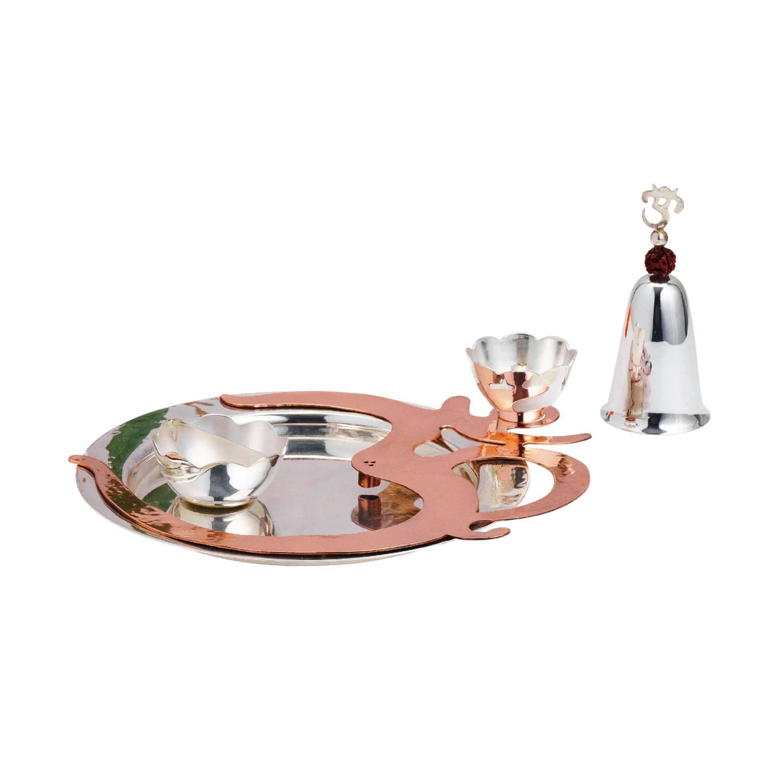 Pooja Thali Om shapes a silver pooja tray as the Om symbol, in a two-tone silver and copper-toned plating - white background