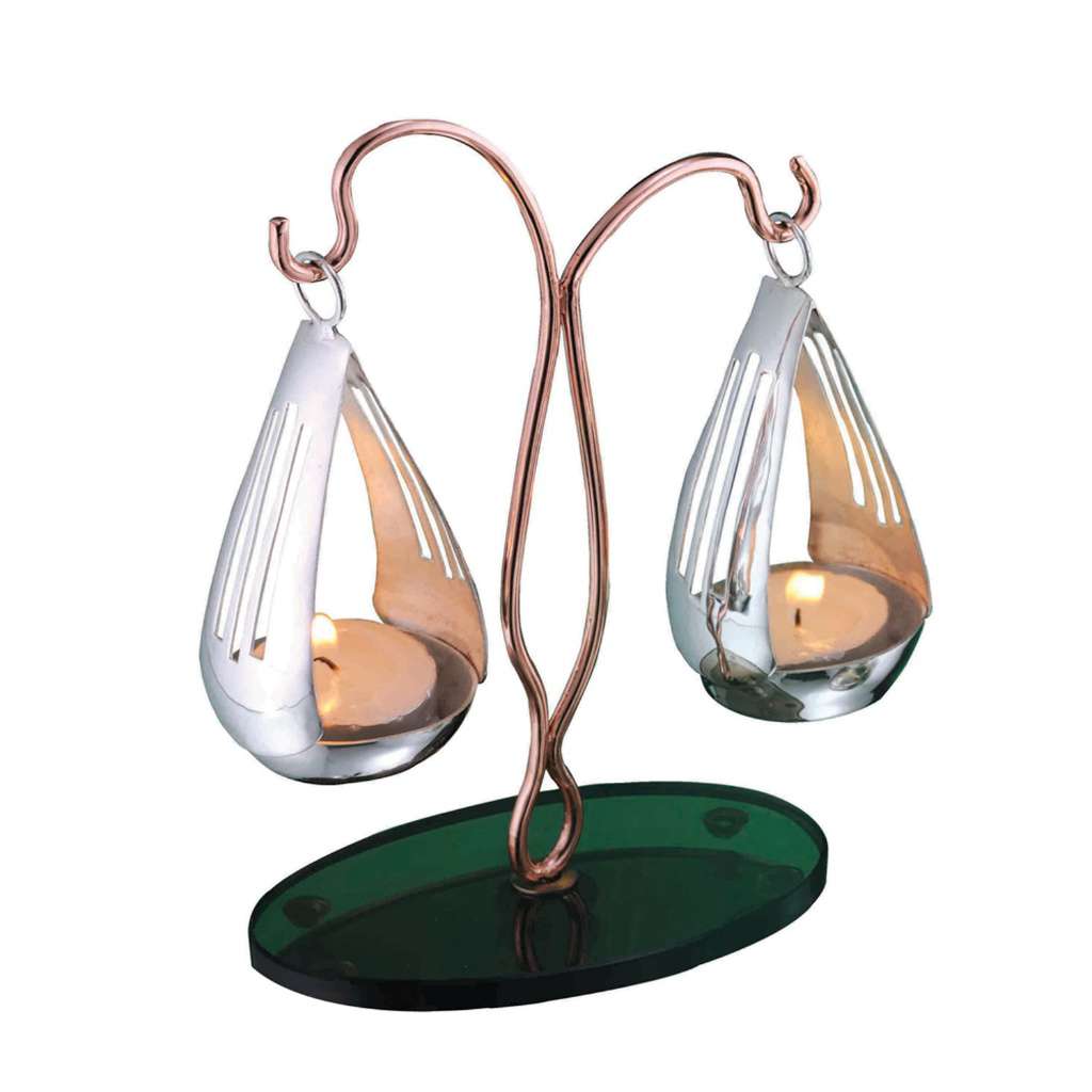 Tealights Holder Balance is a silver tea light holder shaped like a small balance scale - white background