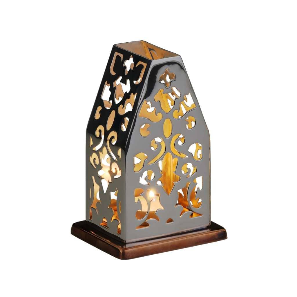 Tea Lights Labyrinth is a silver tealight holder that rises like a small lantern house, its walls - white background