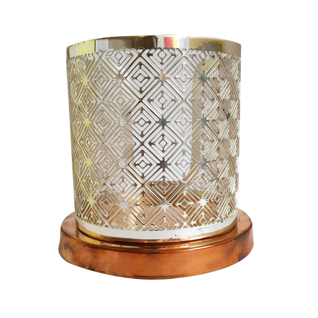 Votive Round Signature is a silver votive wrapping a repeating diamond cutwork pattern around a cylindrical shade - white background