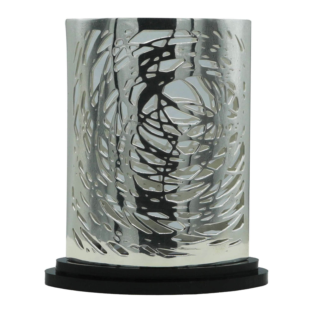 Votive Cosmos is a silver votive wrapping an abstract, laser-cut pattern from Episode&