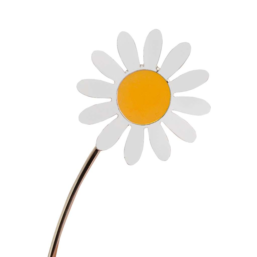 Flower Days Eye holds a single silver daisy on a slender curved stem, its white enamel petals framing a bright yellow enamel centre - white background