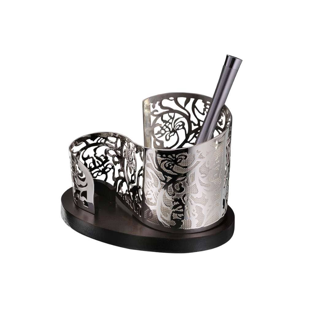 Pen Stand Tree Of Life is a silver pen stand rising in two curved compartments from a dark oval wood base - white background