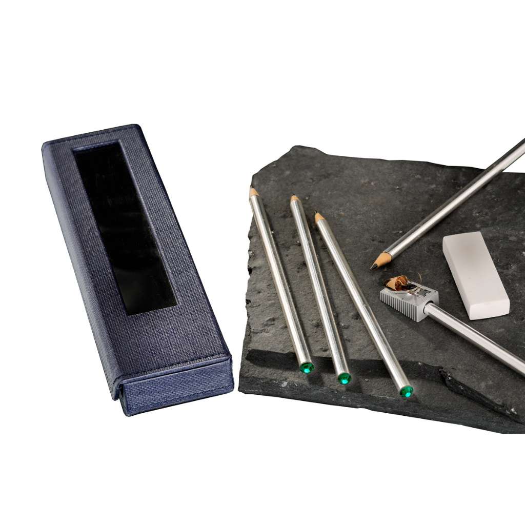 Stationary Auroral pairs a set of silver pencils, each tipped with a small green gemstone - white background