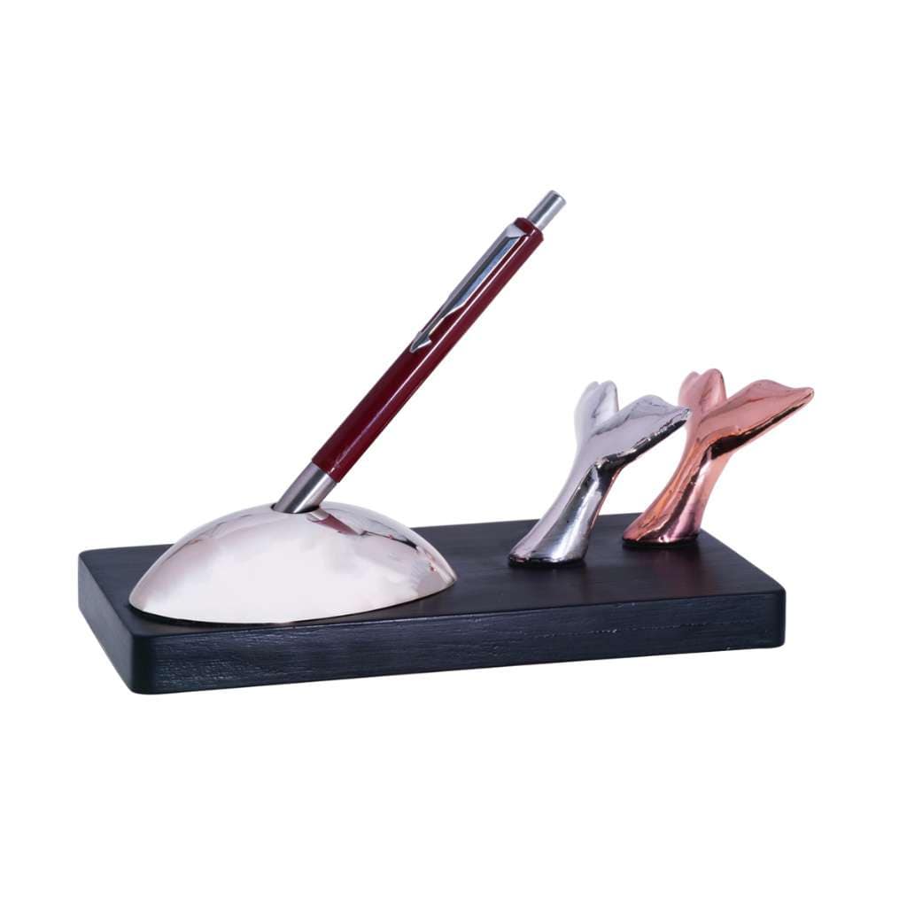 Pen Stand Whale is a silver pen stand centred on a rounded dome that holds a single pen upright - white background