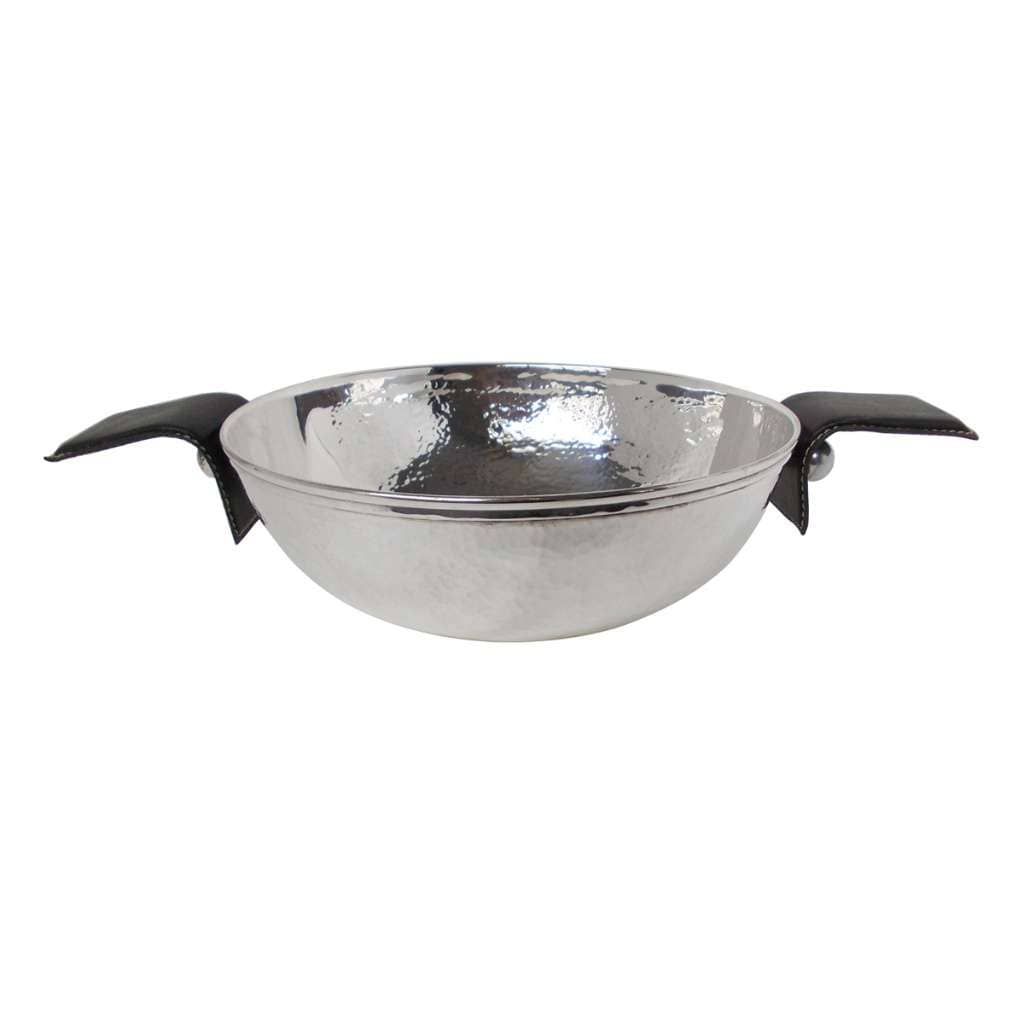Bowl With Leather Handle Hammered is a rounded silver bowl that catches light with every dimple of a hammered texture - white background