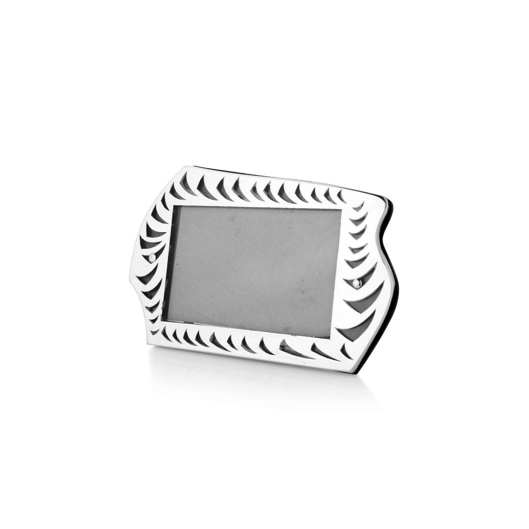 Photo Frame Eddy is a silver frame that curves into a wavy silhouette at the top instead of running - white background