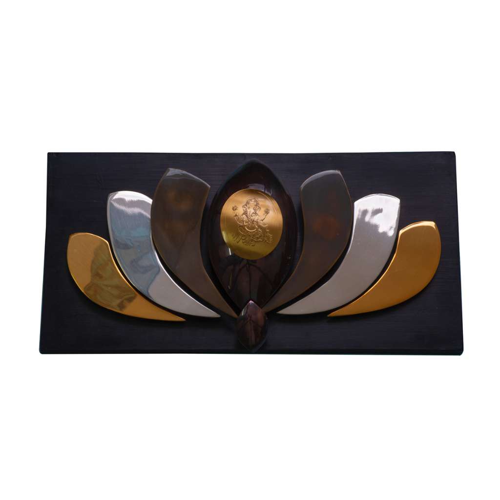 Lotus Wall Art Ganesha is a silver wall art piece setting a single engraved Ganesha medallion at the centre of a stylised lotus mounted on a black lacquered wood plaque - white background