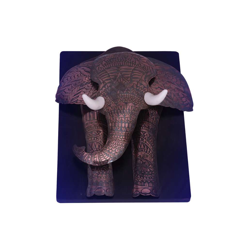 Wall Art Elephant is a silver wall art piece shaped like an elephant head, mounted on a rectangular dark plaque - white background