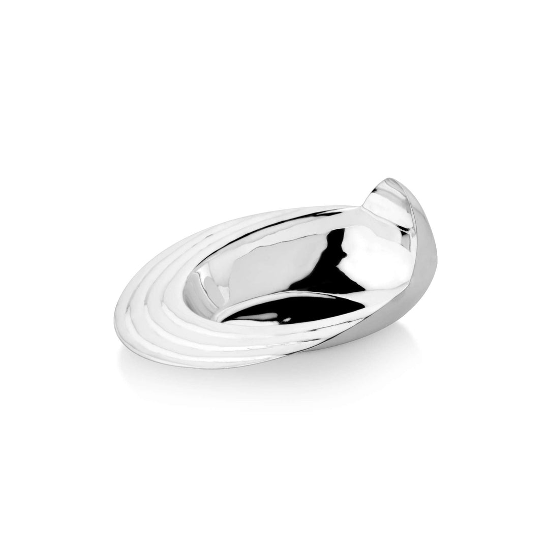 Bowl Spill shapes a silver bowl into an oval, spilled form, one edge lifting into a curved loop that - white background