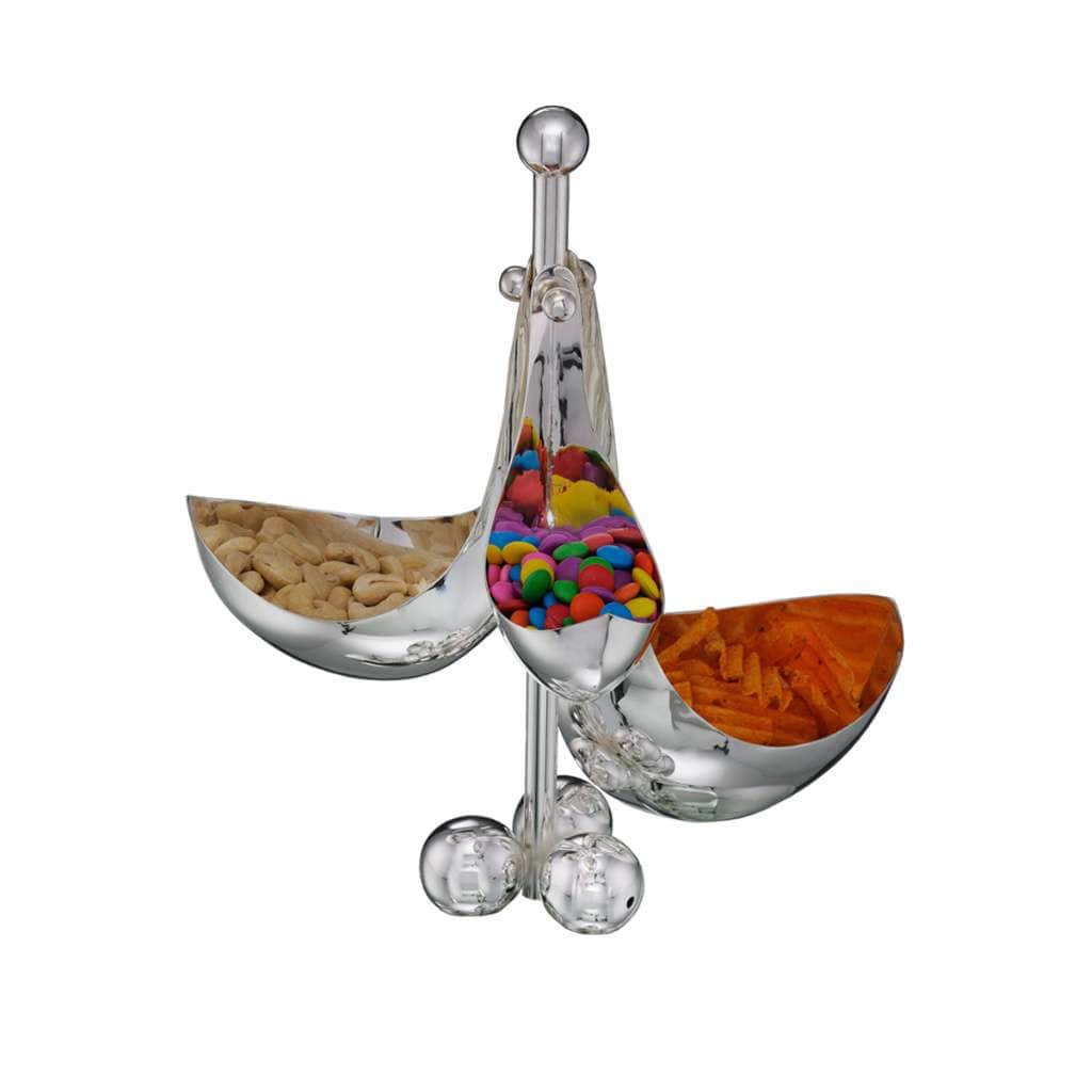 Bowl Trine arranges three elongated, flared silver bowls around a single stem, each one tilted to hold nuts - white background