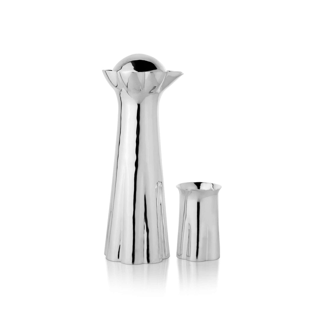 Jug Anymone is a silver jug that rises in a fluted, flower-like silhouette opening into a scalloped rim – 1 Glass
