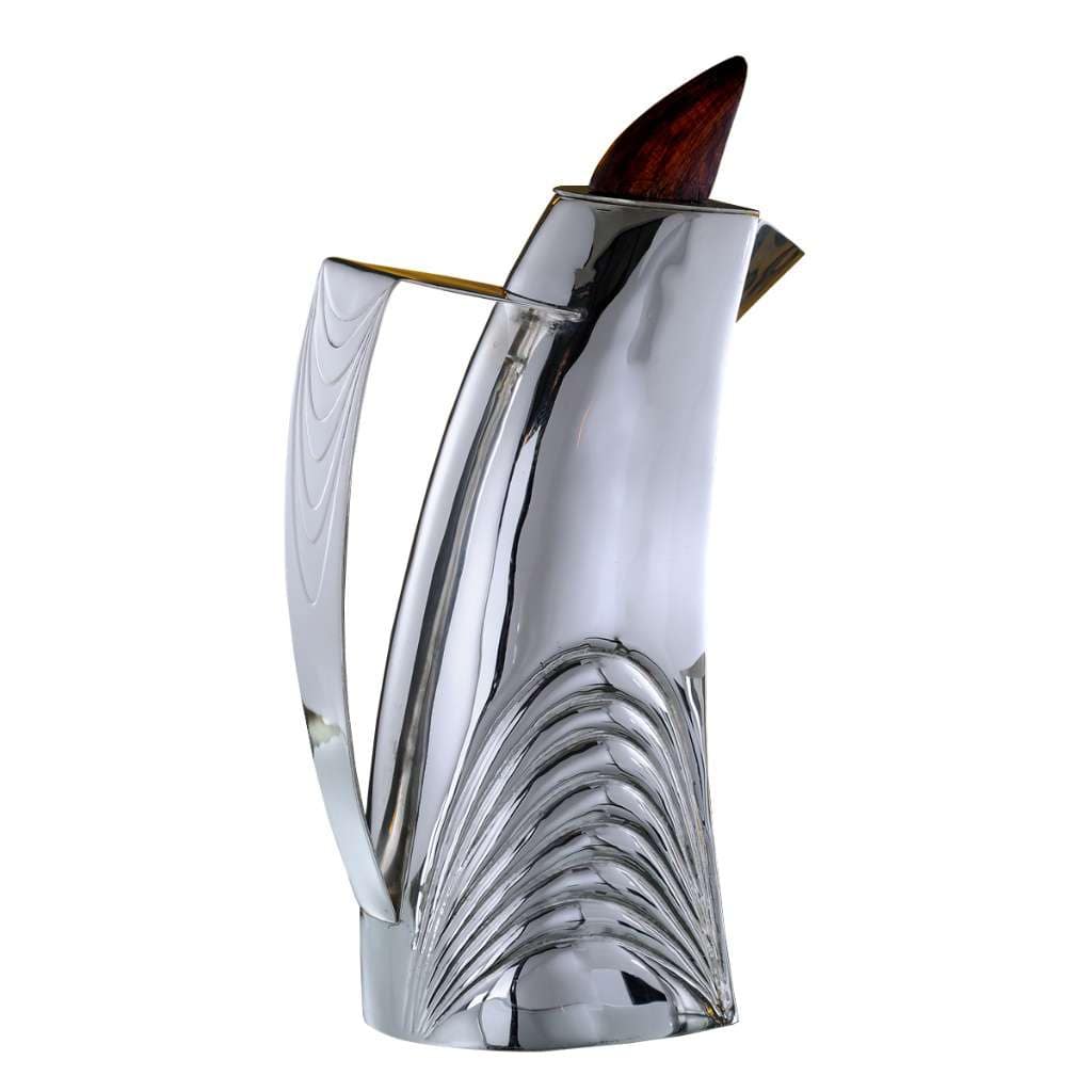 Jug Elegence sweeps fan-fluted ribbing up one side of this silver jug&