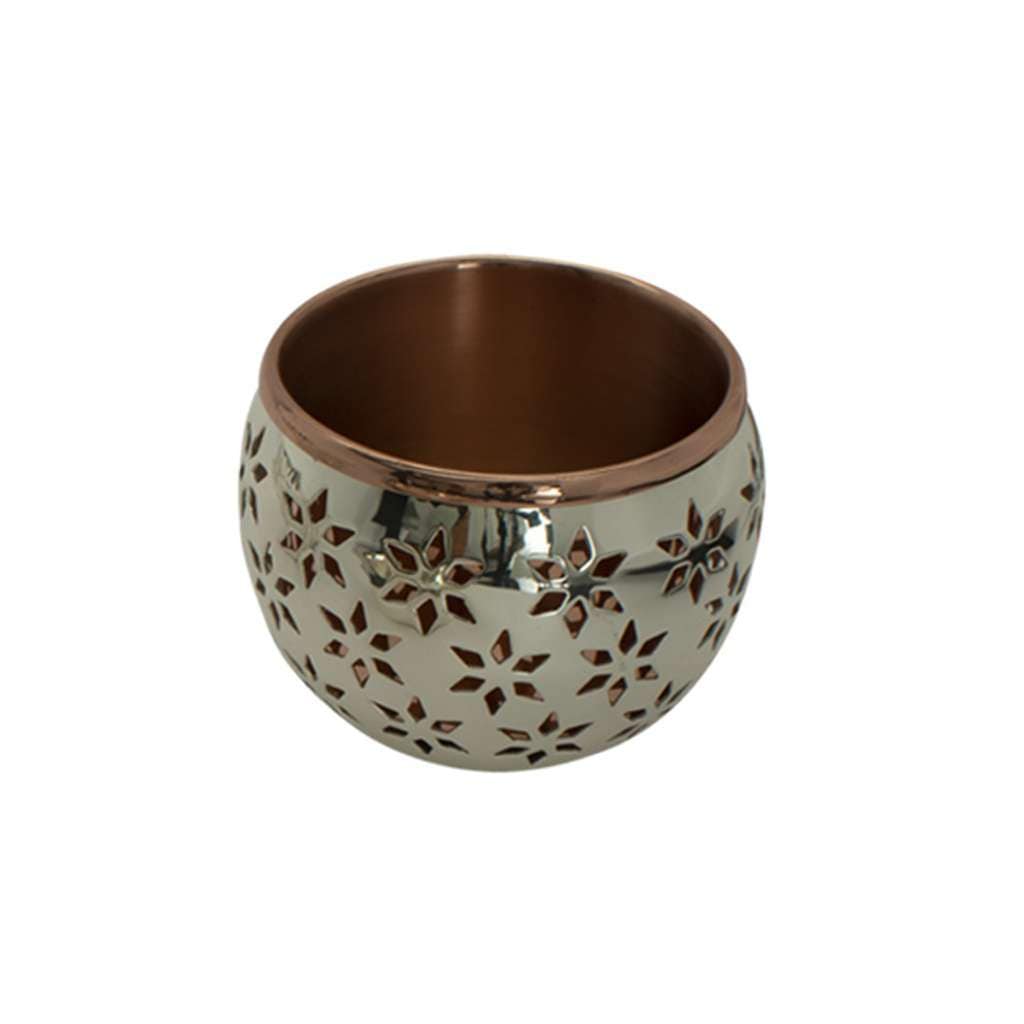 Nut Bowl Illision pierces this silver bowl all over in a repeating star and snowflake pattern - white background