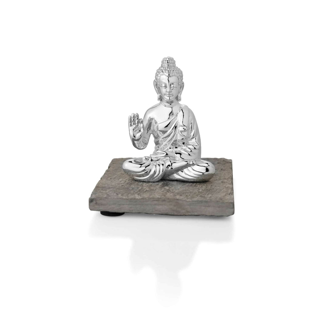 Peaceful Buddha, a sterling silver idol, sits cross-legged on a rough cut slate base - white background
