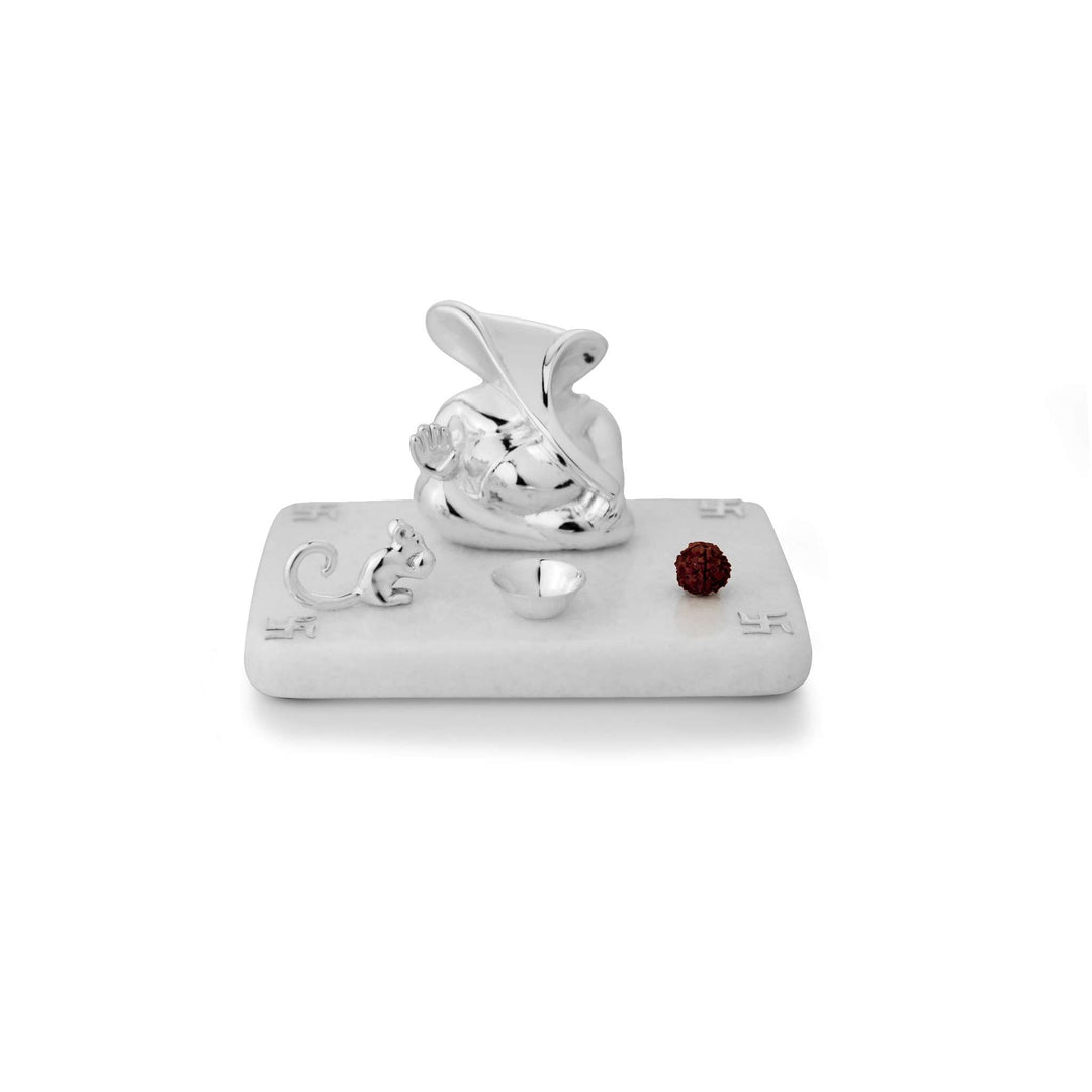 Mandir Gyaneshwara is an abstract, sculptural sterling silver Ganesha idol shaped like a mandir - white background