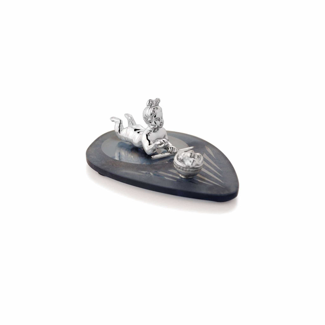 Krishan Bal Krishna shows a sterling silver idol of the child Krishna, known as Bal Krishna - white background