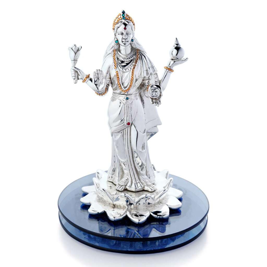 Laxmi Standing shows a sterling silver Lakshmi idol on a lotus in a flowing draped saree - white background